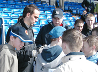 Wayne signs autographs